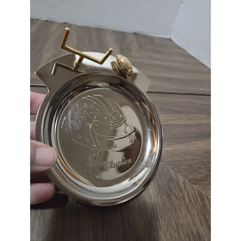 silver-tone and brass football 